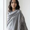 Pure Cashmere Fabric – Crafted from premium-grade cashmere, offering exceptional softness, warmth, and lightweight comfort Swarovski Embellishment – Delicately adorned with subtle Swarovski crystal detailing for an elegant, refined shimmer Suede Fringe Finish – Finished with rich suede fringes, adding texture and a sophisticated edge Generous Size – Measures 200 x 70 cm, perfect for versatile styling as a wrap, stole, or shawl Timeless Neutral Tone – A classic earthy shade that complements both formal and casual ensembles Artisan Craftsmanship – Expertly finished to ensure durability and a luxurious drape