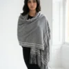 Pure Cashmere Fabric – Crafted from premium-grade cashmere, offering exceptional softness, warmth, and lightweight comfort Swarovski Embellishment – Delicately adorned with subtle Swarovski crystal detailing for an elegant, refined shimmer Suede Fringe Finish – Finished with rich suede fringes, adding texture and a sophisticated edge Generous Size – Measures 200 x 70 cm, perfect for versatile styling as a wrap, stole, or shawl Timeless Neutral Tone – A classic earthy shade that complements both formal and casual ensembles Artisan Craftsmanship – Expertly finished to ensure durability and a luxurious drape
